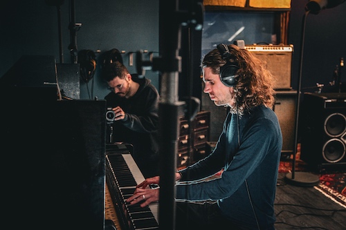 Jonni Slater playing piano in the studio