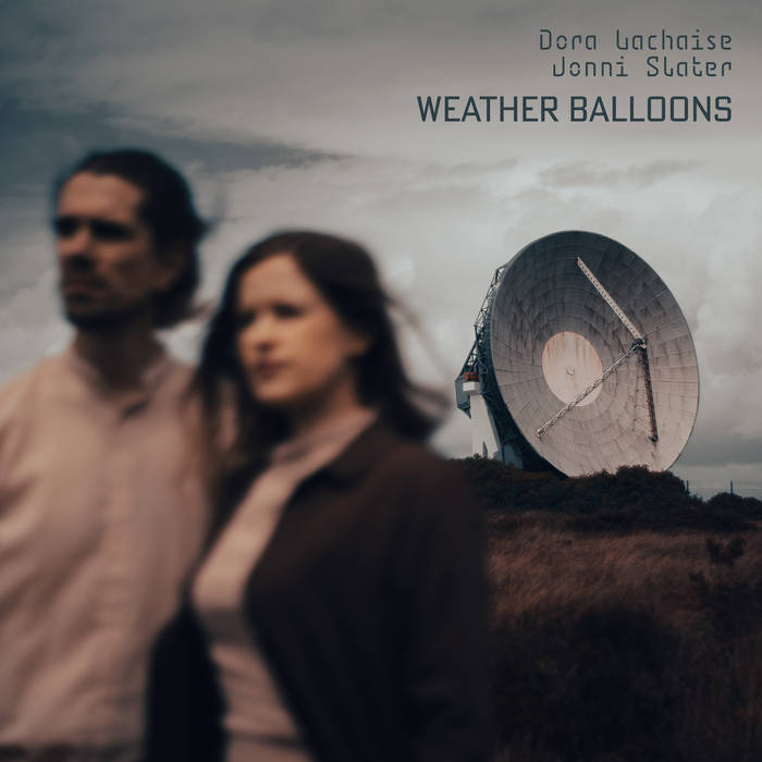 Weather Balloons cover, with Jonni and Dora standing windswept with a radio communications dish in the background